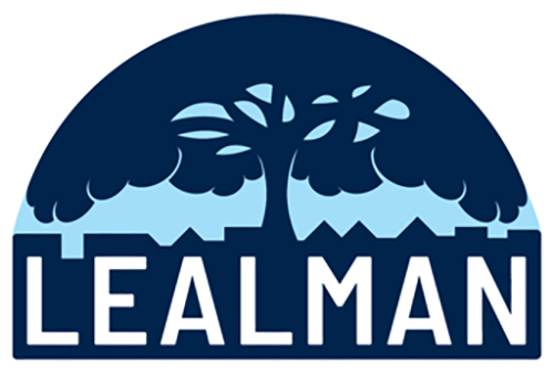 Lealman logo, a large tree over a cityscape with the word Lealman